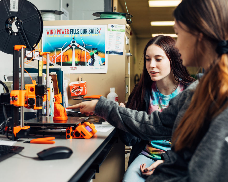 two women working on a 3D printer in Chattanooga, Tennessee